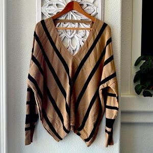 Oversized, deep V, sweater.